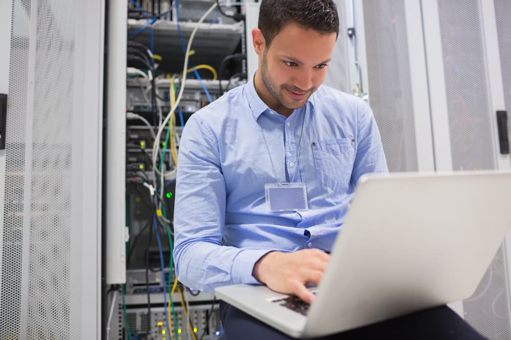 A Roswell IT technician working on a server rack